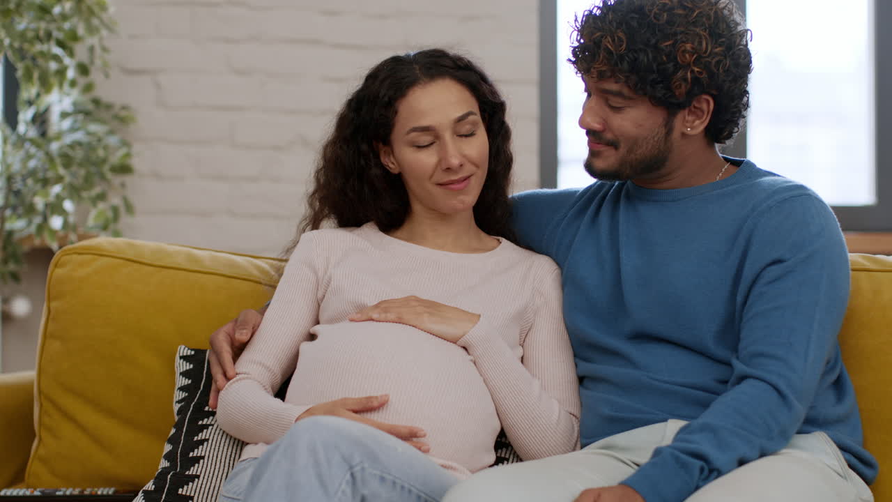 Pregnant Couple on a Couch