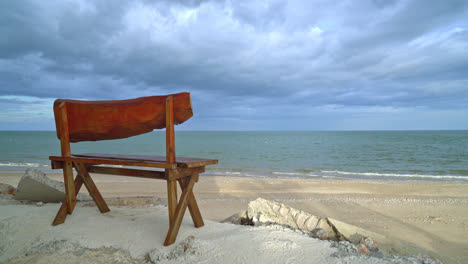 empty wood bench on beach with sea beach background