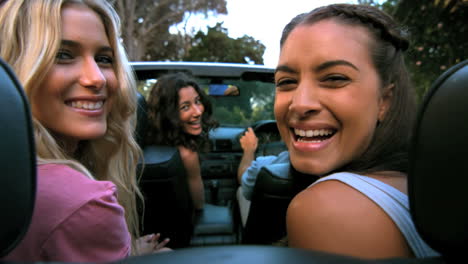 friends laughing in the car