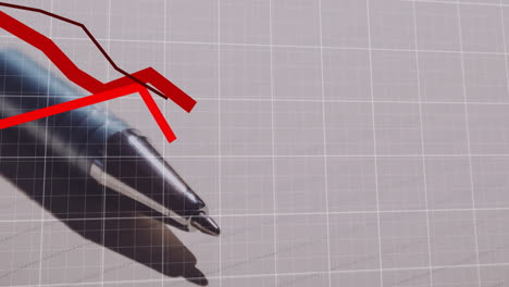 metallic ballpoint pen tip sliding over graph page, highlighting red zigzag trend over white grid