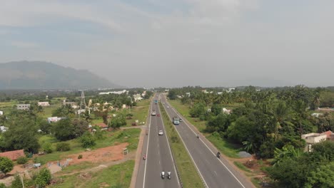 Flying-over-the-centerline-of-a-highway-in-India-with-full-of-traffic