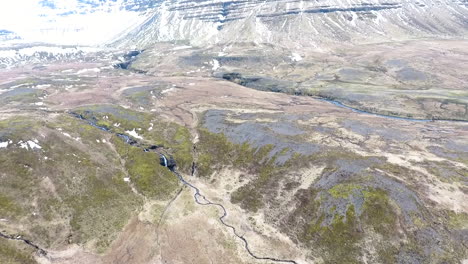 Drone-Shot-Tilting-Up-to-Iceland-Mountains-with-Snow