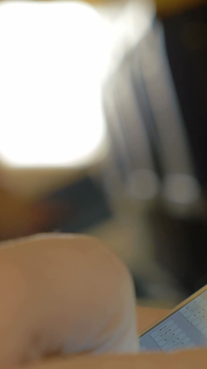 Close-up of a finger typing on a smartphone