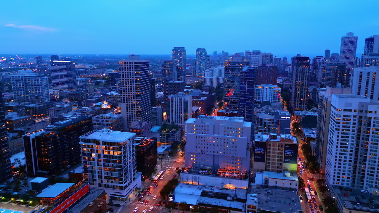 Chicago, USA, 29 June 2025: Vast urban landscape of modern Chicago, Illinois, USA. Lively traffic on the roads of the city at dusk time. Aerial view