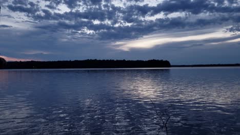 end of a beautiful sunset over a peaceful lake