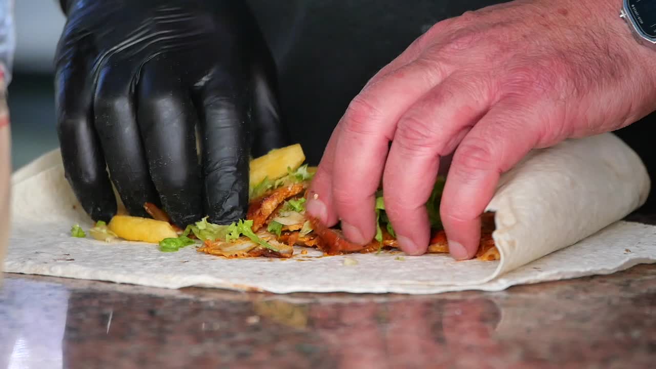 Making a delicious shawarma wrap with chicken and fries