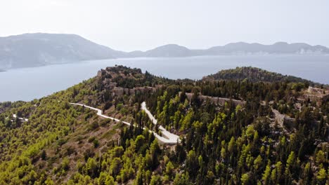 Castle-Ruins-On-Top-Of-The-Hill-In-Kefalonia,-Greece---aerial-drone-shot