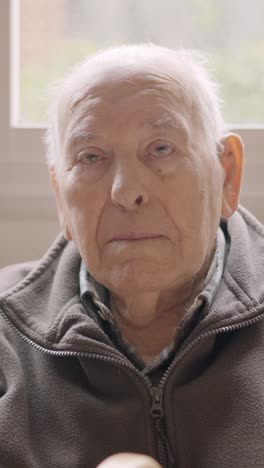 aged man looking serious sitting on a geriatric