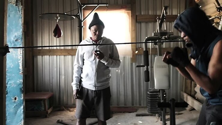 Boxer practicing shadow boxing in the gym