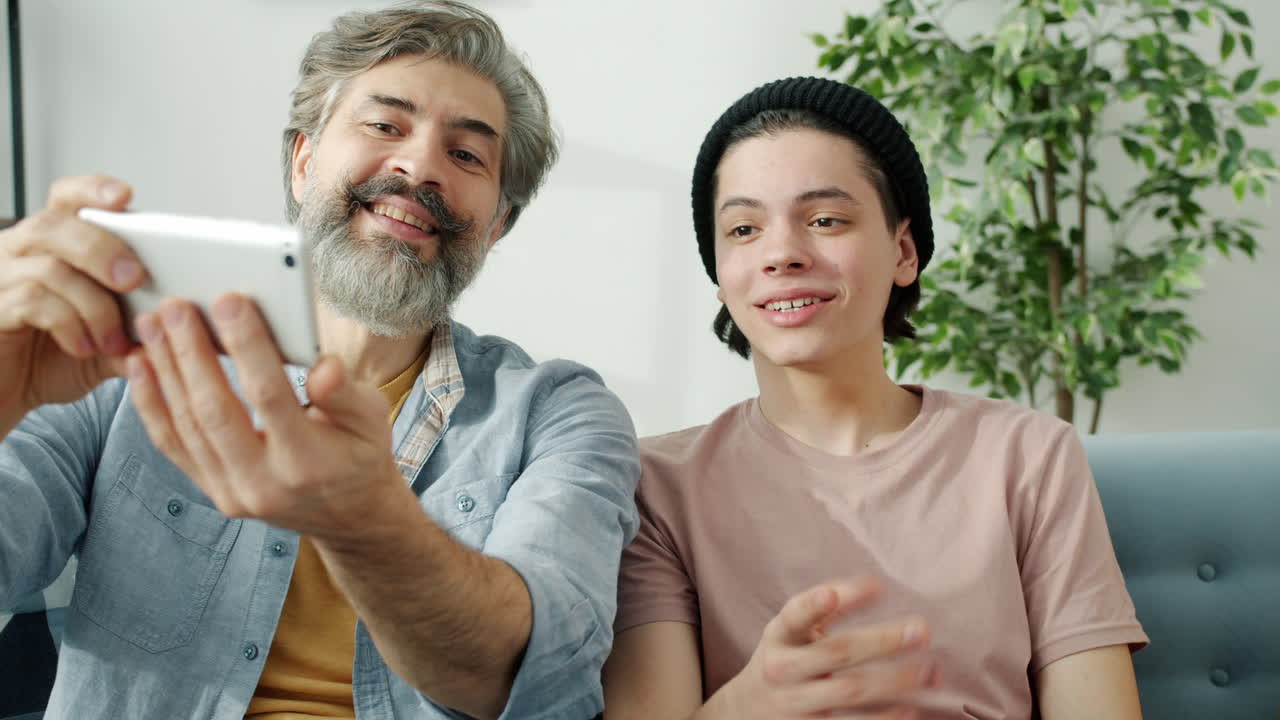 Father and Son Taking a Selfie Together