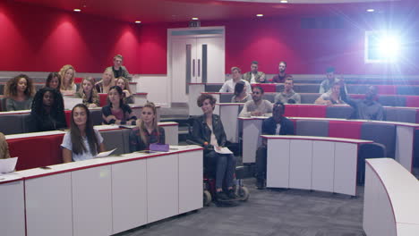 university students in discussion at a lecture theatre, shot on r3d