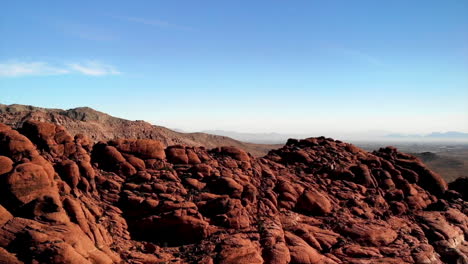 rising drone shot of sandstone mountains at red rock canyon park in nevada