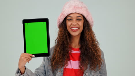 green screen, tablet and woman pointing for review