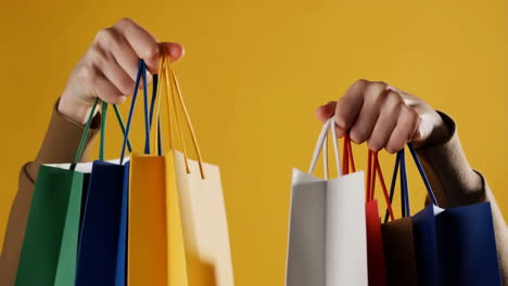 shopping bags held by hands