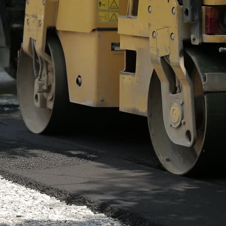 laying asphalt with road construction