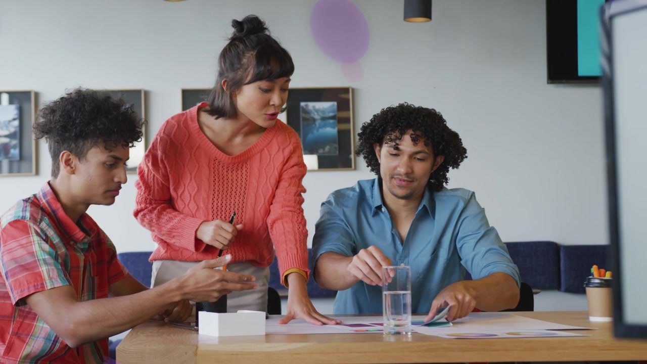 Woman presenting pages, office team reviewing papers, magenta rings drifting, hiding then clearing
