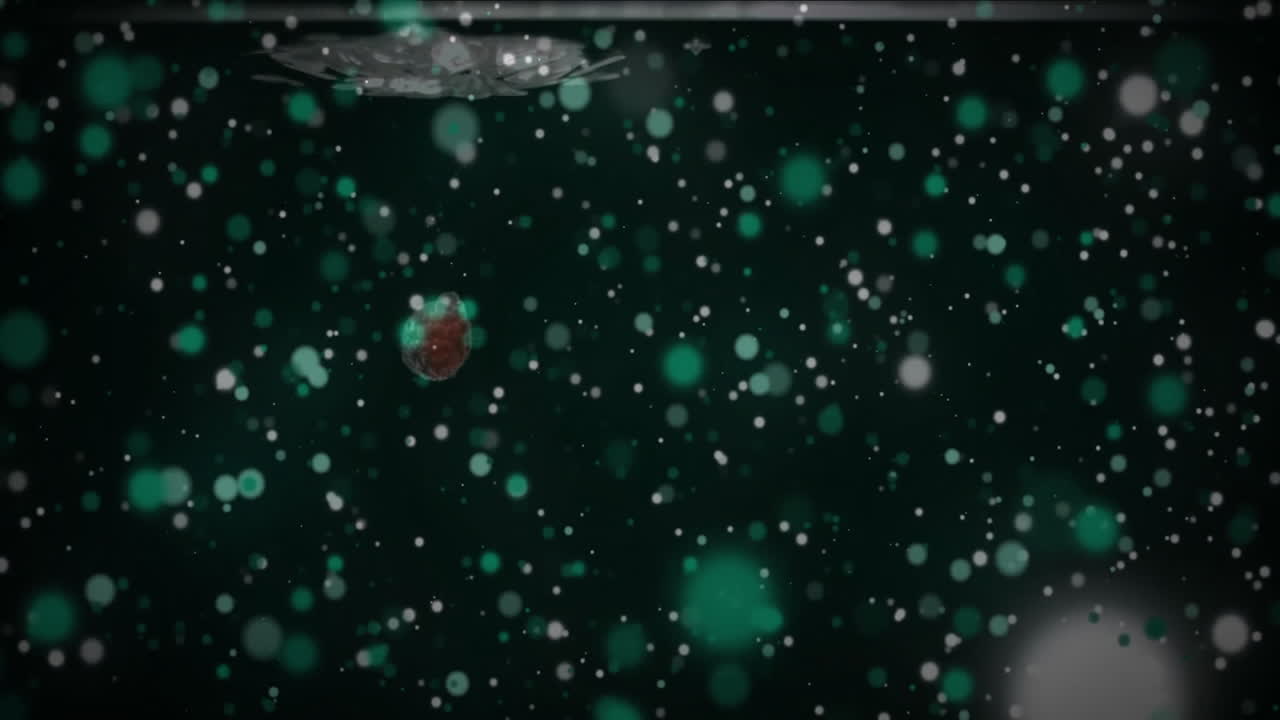 Animation of waterdrop and light spots on black background