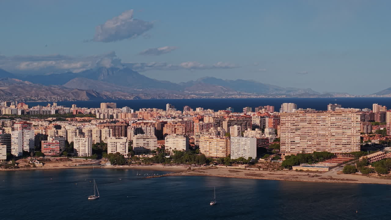 Coastal Cityscape with Mountains and Sea
