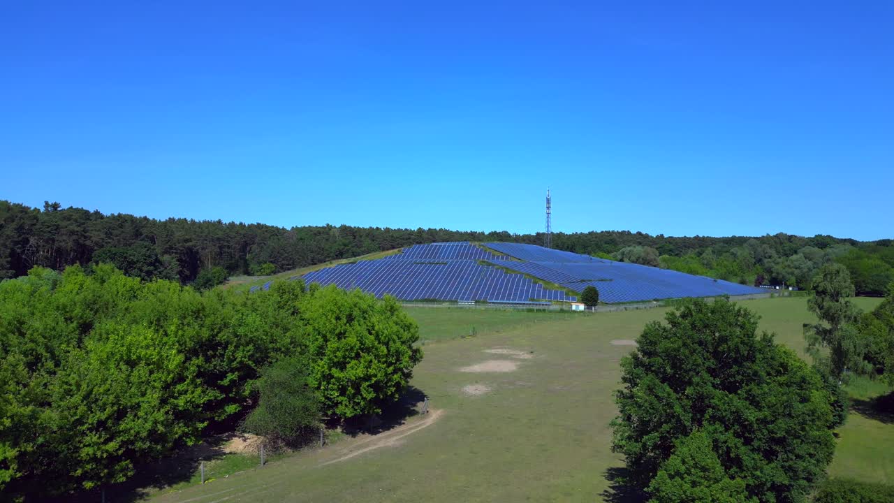Photovoltaic panels installed on a former landfill, transforming a waste site into a source of renewable energy, a solution for the future. Lovely aerial view flight overflight flyover drone