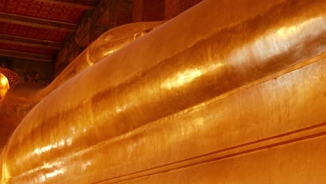 golden buddha statue in bangkok's wat pho temple