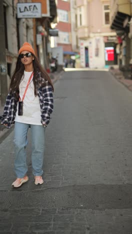 young woman walking in a city street