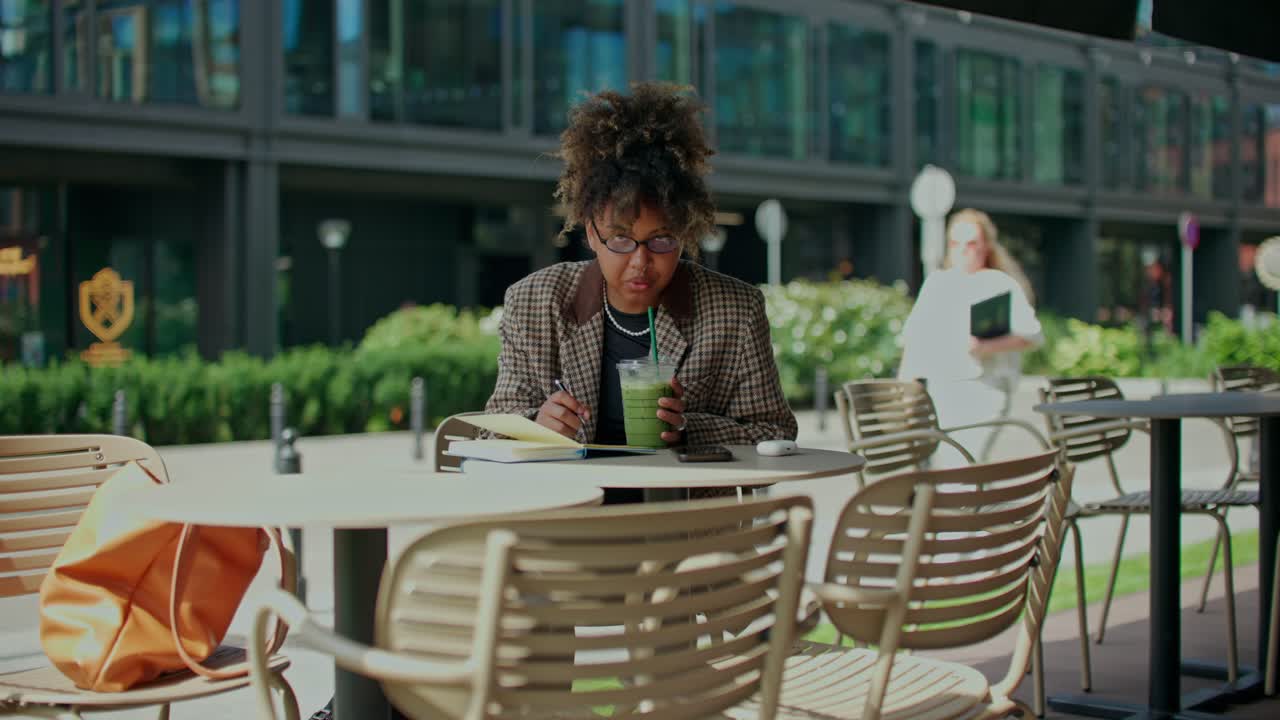 Woman working at an outdoor cafe