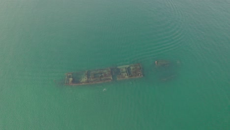 Aerial-shot-of-a-sunken-ship-on-Manzanillo-beach