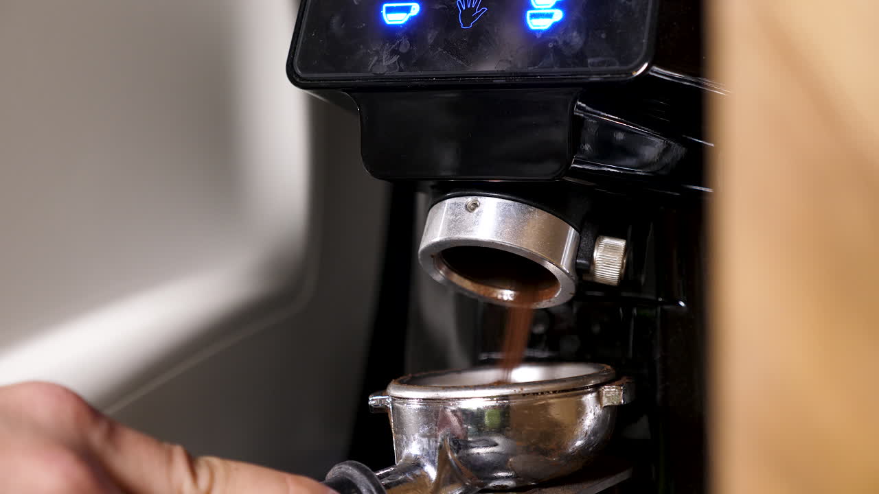 Grinding coffee with an espresso machine