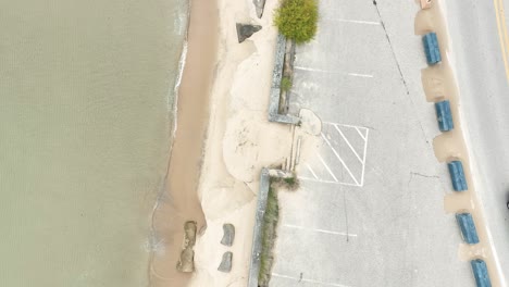 an endangered shoreline buffed with various measures to keep the sand in place