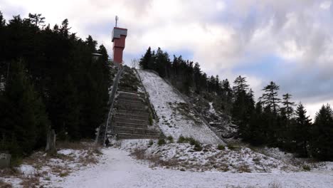 abandoned old winter sports ski jumping hill covered with snow