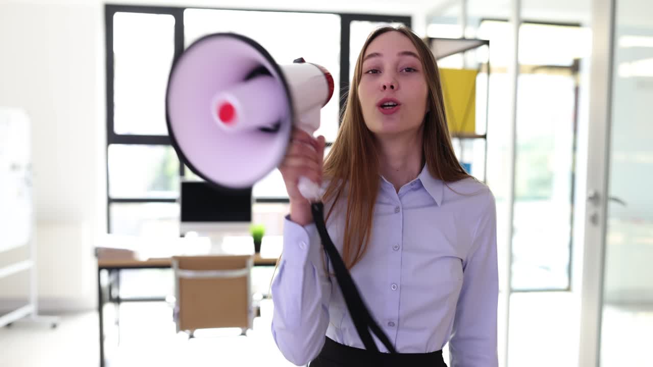 Woman with megaphone in office