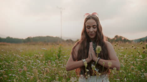 woman meditating in the bosom of nature calming down and seeking inspiration