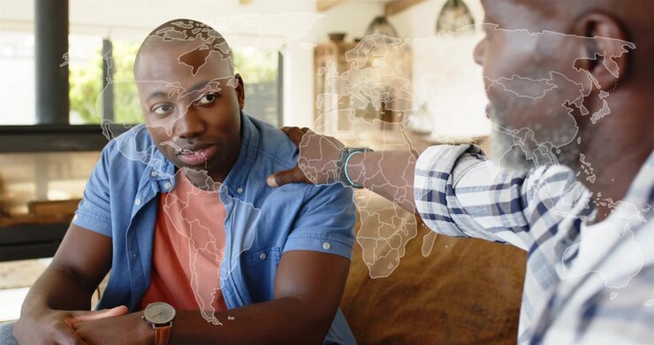 Elder man placing hand on shoulder and causing faint map overlaying faces guiding family therapy