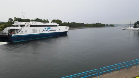 ferry traversing muskegon channel in early morning