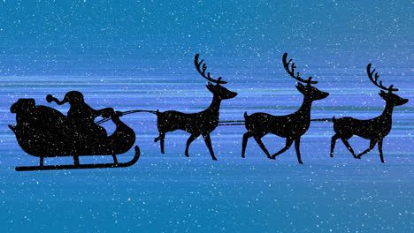 Snow-falling-over-santa-claus-in-sleigh-being-pulled-by-reindeer-and-light-trails-on-blue-background