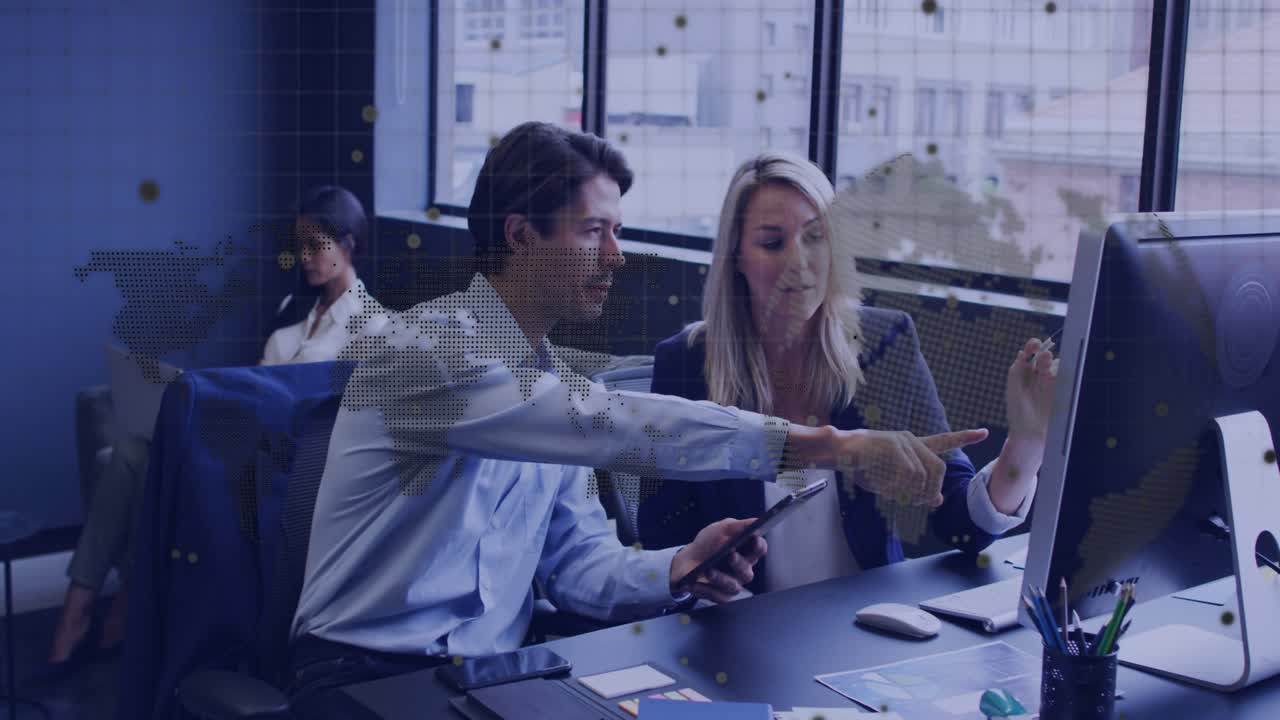 Man tapping tablet and showing animated chart on monitor for coworker reviewing business insights