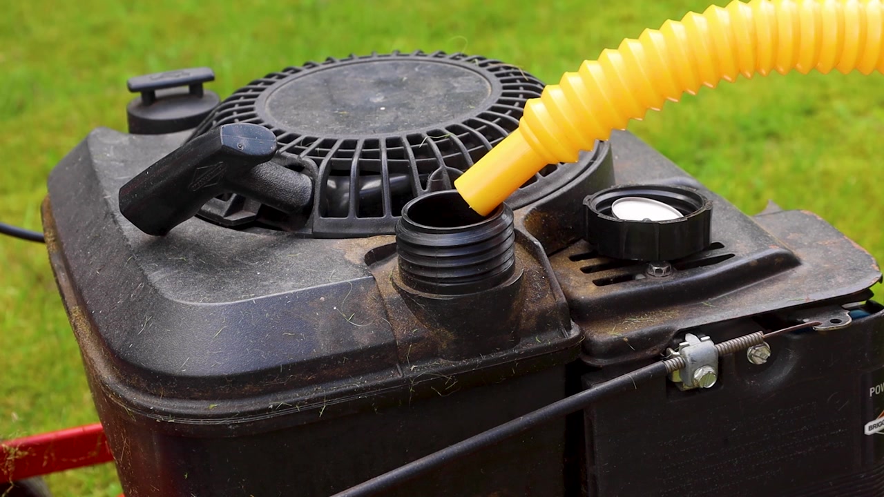 Video putting gas into a mower.