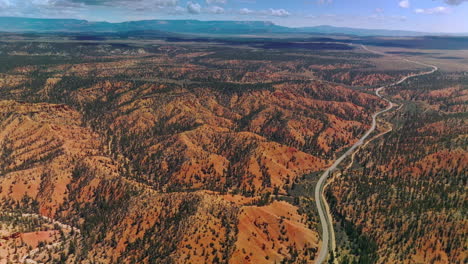 stunning mountainous panorama of zion national park, utah, usa. long motorway going through vast territory of park. aerial perspective.