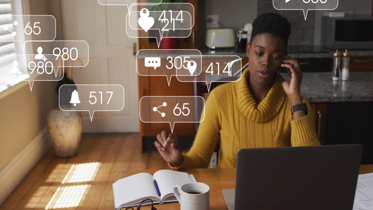 Animation of media icons floating over couple using computer