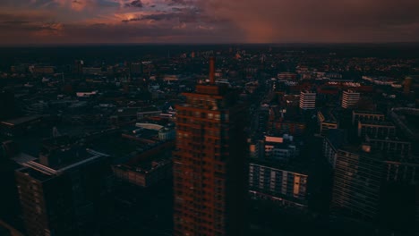 Aerial-hyperlapse-showing-buildings,-cars-and-city-landscape