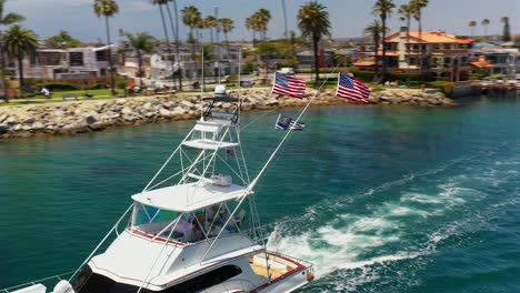 aerial view of a large fishing boat in newport channel flying two american flags