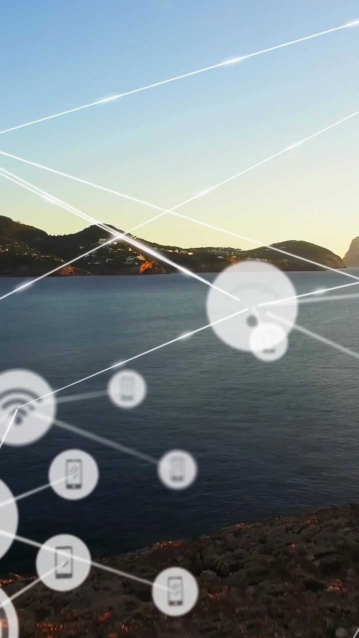 海岸線のある湾の上に、Wi-Fiと電話のノードを含む拡大するネットワークスタイルのオーバーレイが広がっている。