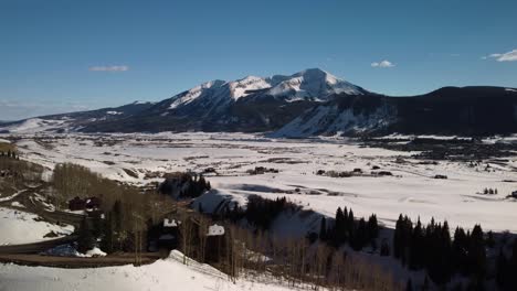 Flying-towards-Snowcapped-Colorado-Rocky-Mountains-during-the-winter,-Aerial