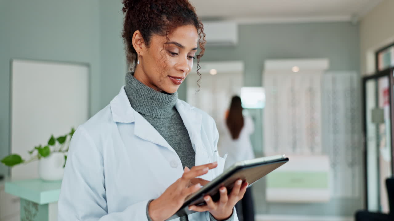 Doctor using tablet in optometry office