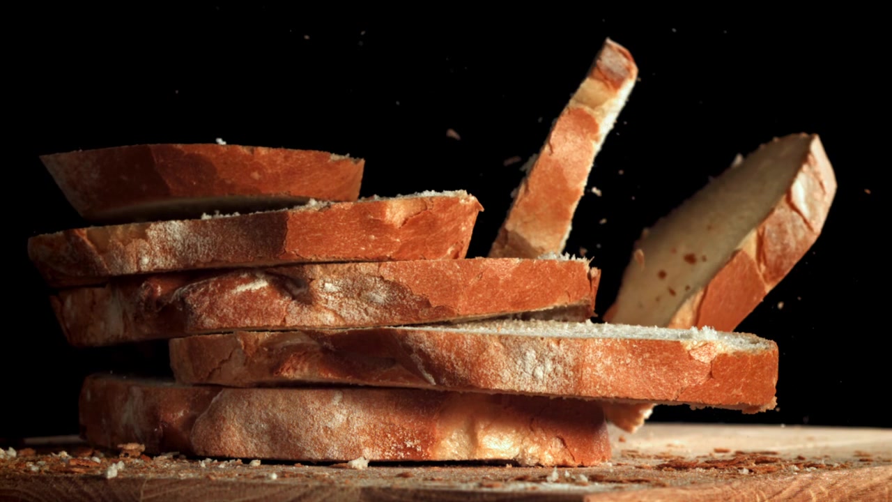 Rustic Bread Slices Falling and Stacking in Slow Motion