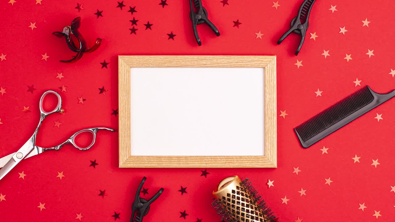 Stop motion animation of mockup wooden frame flat lay of professional hair cutting shears, gold round hair brushes for styling, comb for separating hair hairpins section hair clips and stars on red