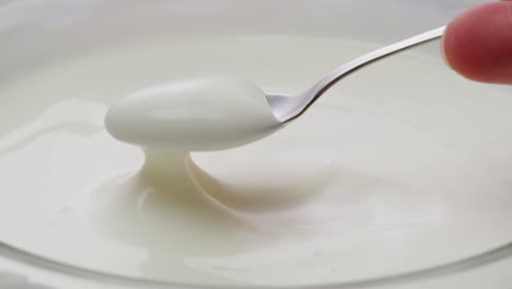 mixing yogurt with a spoon