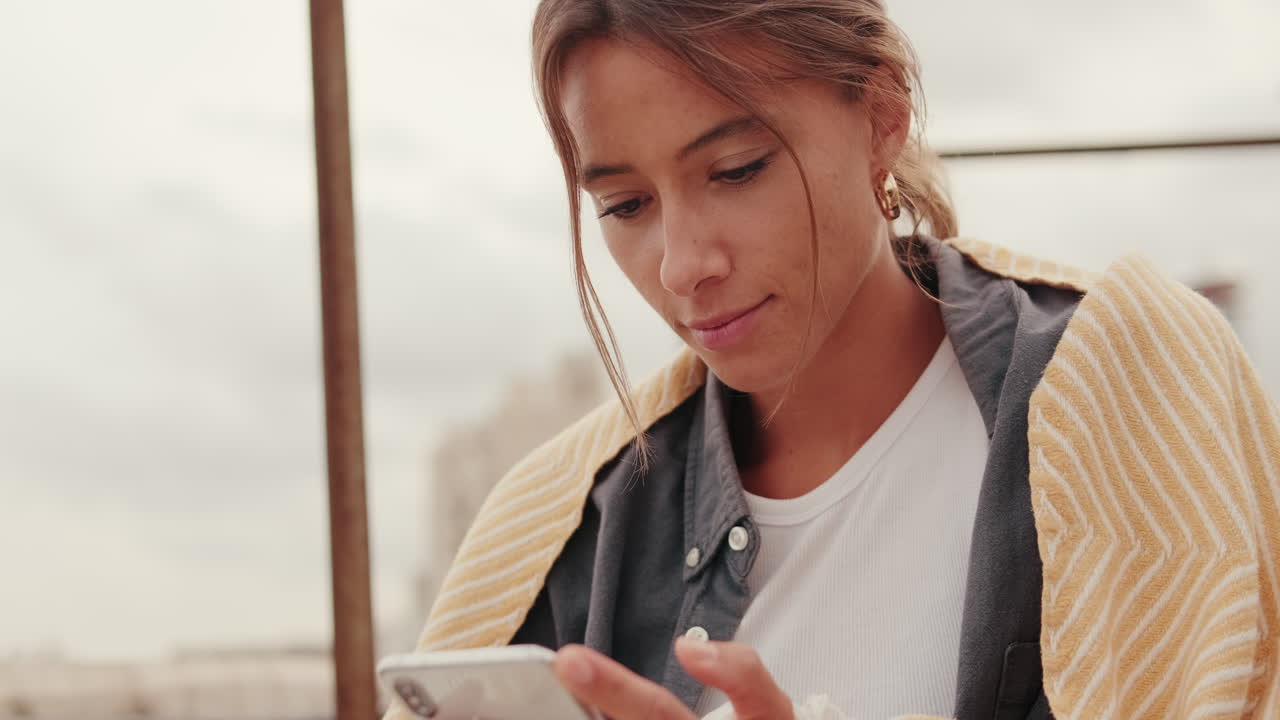 Close-up of Young Woman Using Smartphone Outdoors