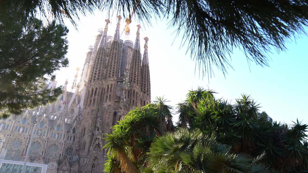 Quick pan down of La Sagrada Familia from the park opposite, Barcelona