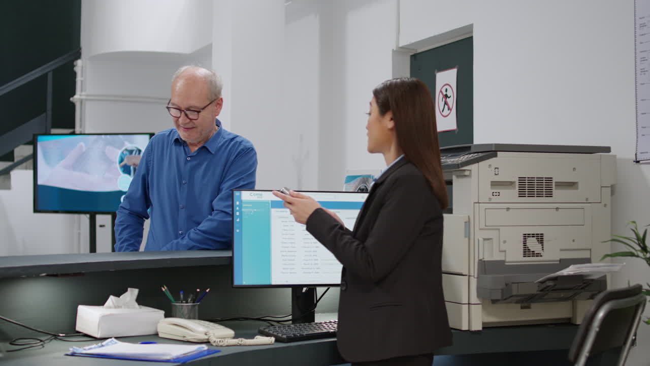 Patient paying at hospital reception